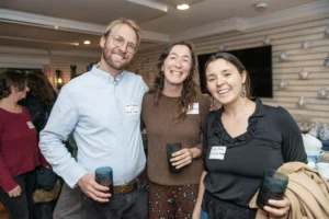 Ian Ridgeway and Casey Blum of MV Ocean Academy with Hilary Dreyer (center) of Camp Jabberwocky