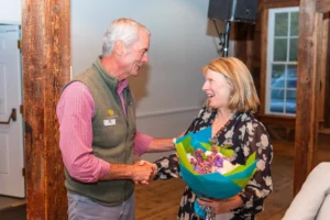 MVCF Board President Alec Walsh congratulates Cathlin Baker