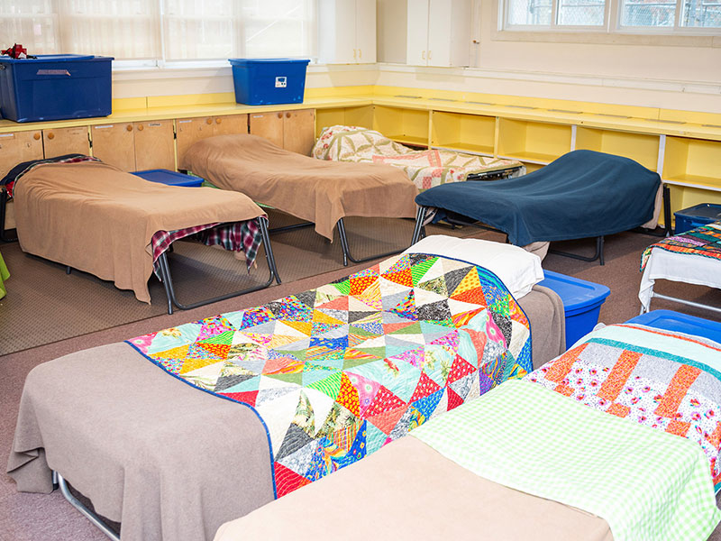 cots set up for winter shelter